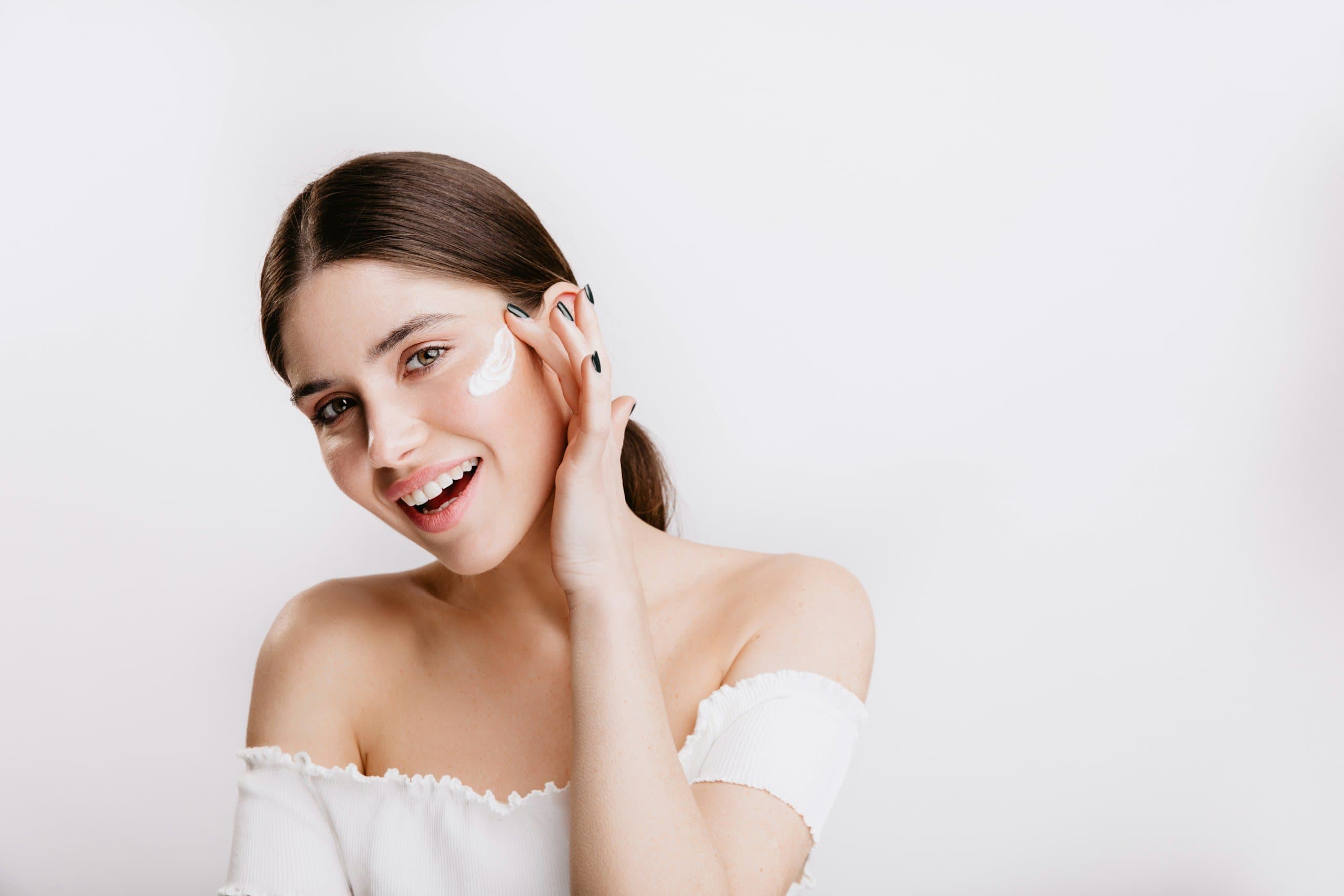 Young woman with clear skin smiling