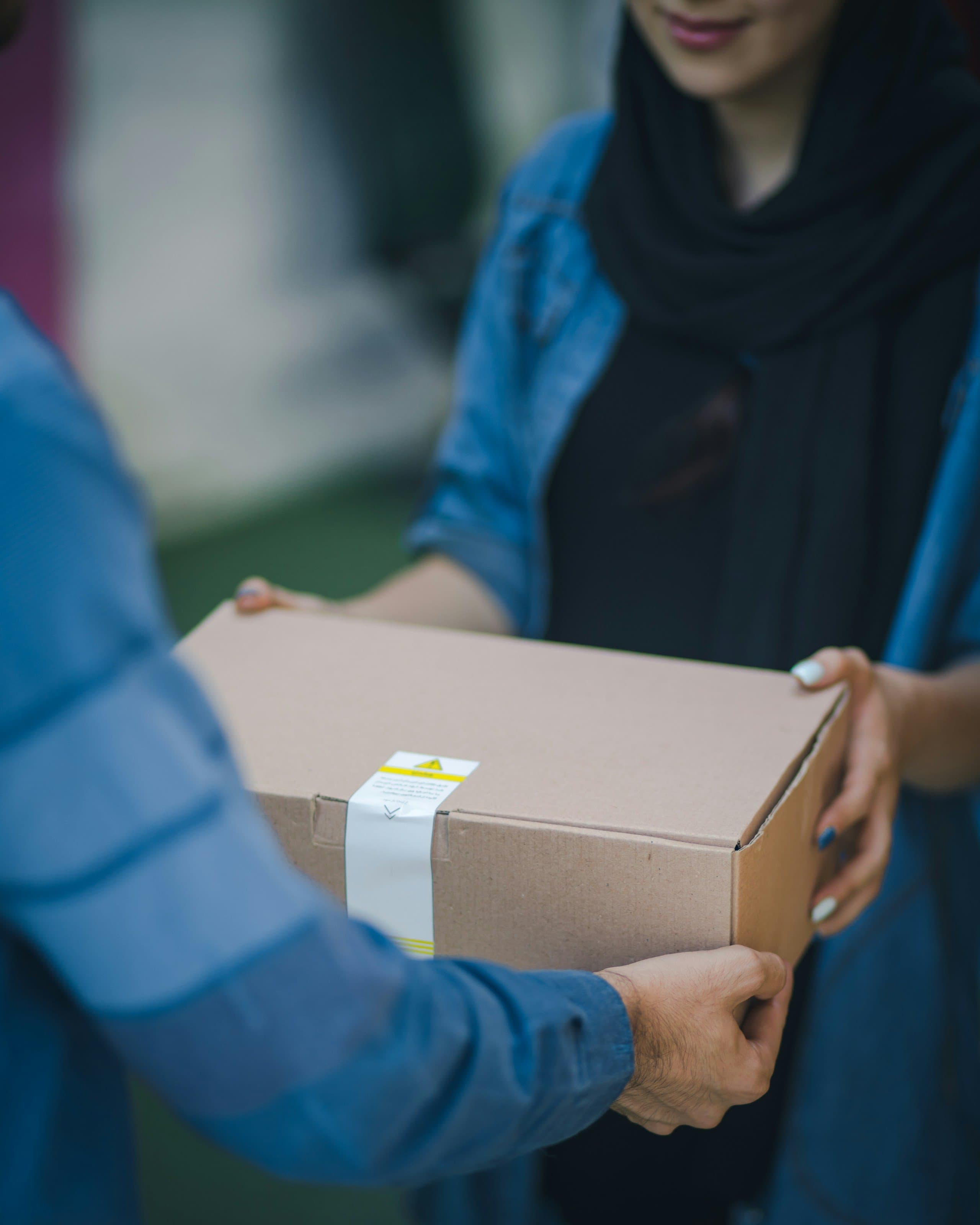 Prescription order handed over at the door during a free home delivery