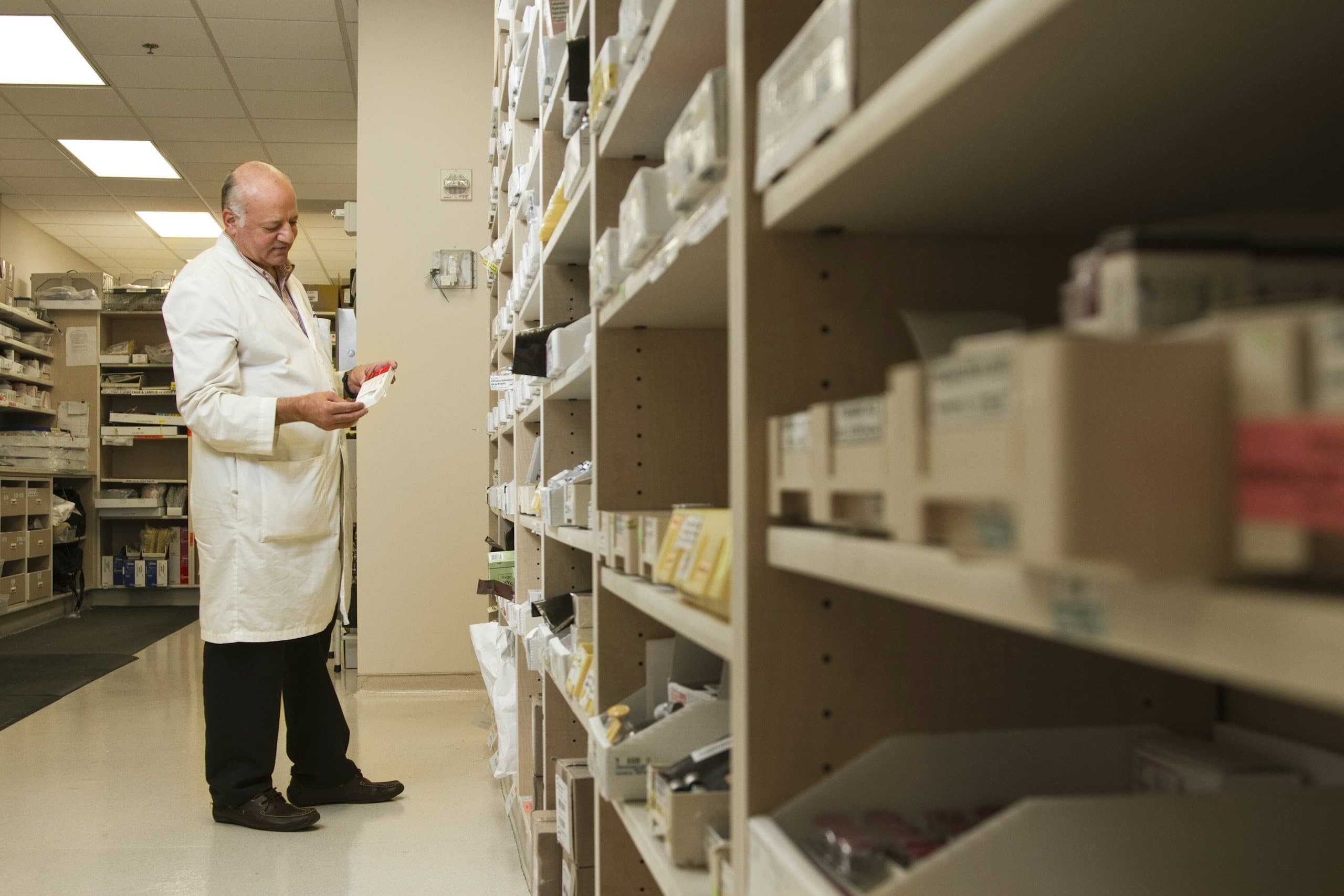 Pharmacist working in the pharmacy aisle